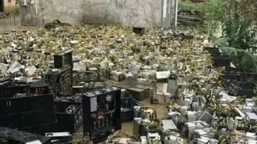 A sprawling mining farm with rows of cooling fans and racks full of ASIC miners